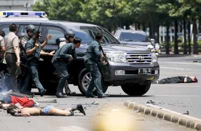 Gunfire and explosion hit Jakarta, at least seven dead
including four militants