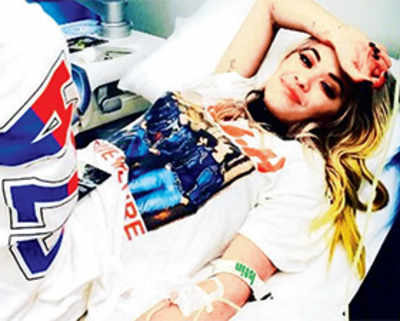 Sexy photo-op lands Rita Ora in the hospital