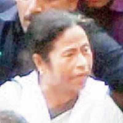 Mamata takes oath, barricades crumble