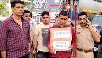 Criminal surrenders wearing placard saying 'don't shoot me' in UP's Amroha 