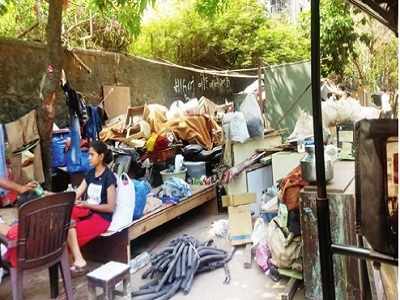 Rising from the wreckage: Slum dwellers take over road and footpath to raise shelters