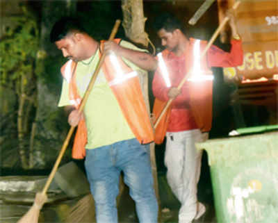 Not machines, but young men spotted sweeping roads