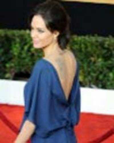 Angelina wears dress backwards