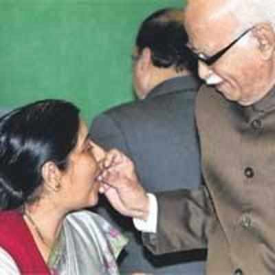 Advani hands over baton to Sushma