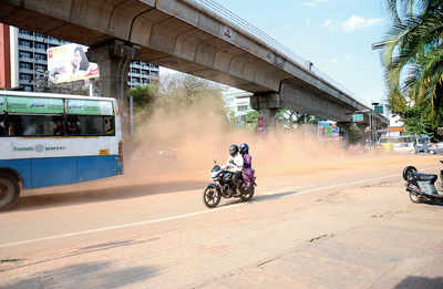 Cloud of dust welcomes motorists on MG Road