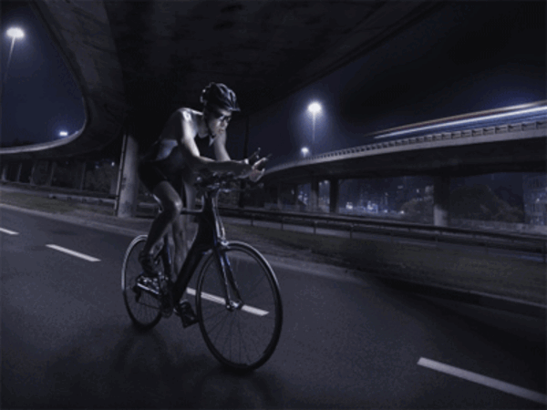 People give a thumbs up to night cycling