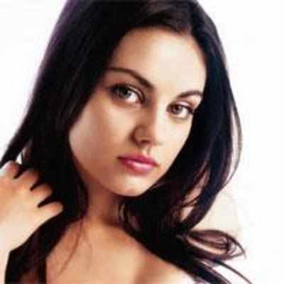 Justin strips off with Mila Kunis