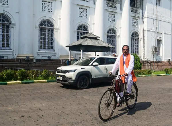 MLAs ride scooters, cycles to oath ceremony to push austerity message