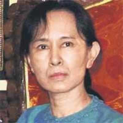 Myanmar's Aung Suu Kyi charged over US intruder