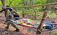 Security forces rescue woman with burns from remote village in Bastar, carry her on makeshift stretcher