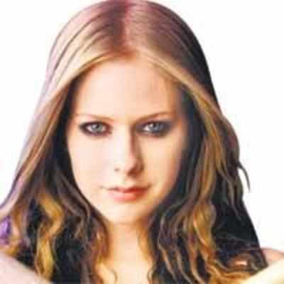 Wedding vows have calmed Avril