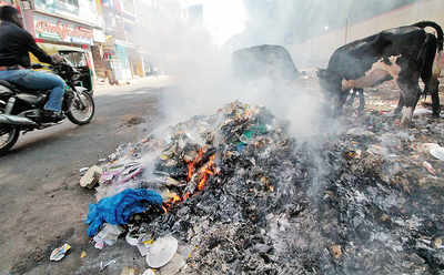 City still dotted with burning garbage
