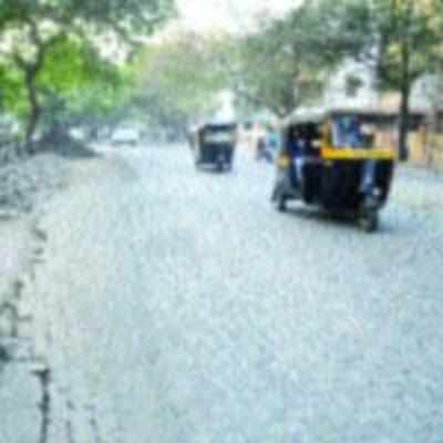 BMC leaves road in a mess while laying pedestrian pathway