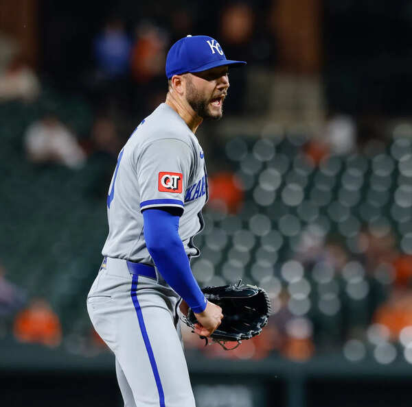 Kansas City Royals manager Matt Quatraro reacts after Mitch Spence turns heads during Spring Training outing