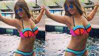 Kim Sharma flaunts belly button piercing in neon bikini 