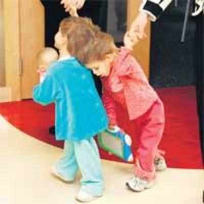 Conjoined twins take first steps
