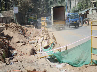 Motorists have to choose between a pit and debris