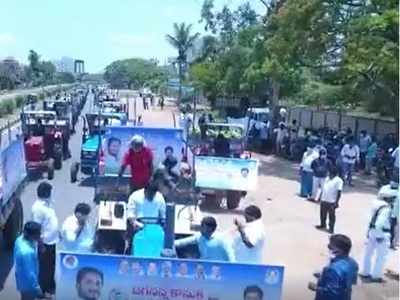 Andhra Pradesh: YSR Congress MLA Kaveti Sanjeevaiah holds tractor rally with grocery for the poor