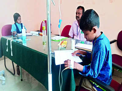 Stung, students write exam at hospital