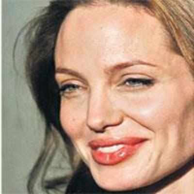 Jolie takes time off  for new son