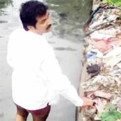Corporator hops, strips and jumps into nullah to protest shoddy work