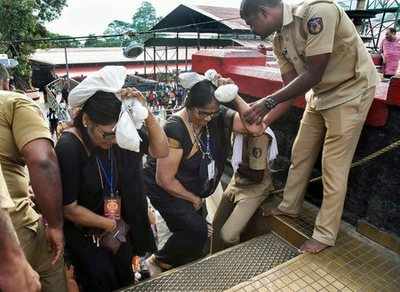 Sabarimala row: Police force two women to abort trek as tension prevails in pilgrim centre