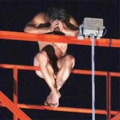 Naked man climbs 220-ft tower, whistles english hymn