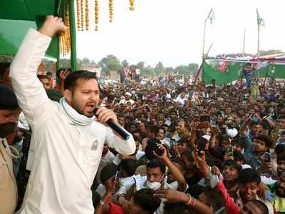 RJD supporters in a celebratory mood: Day ahead of vote count, family, party workers wish Tejashwi on birthday