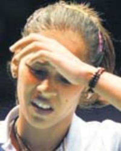 Saina stunned again