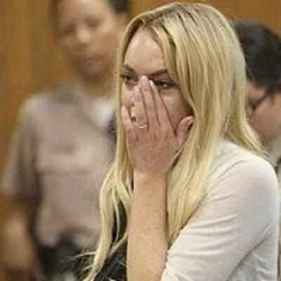 Lindsay Lohan sentenced to jail, cries in court