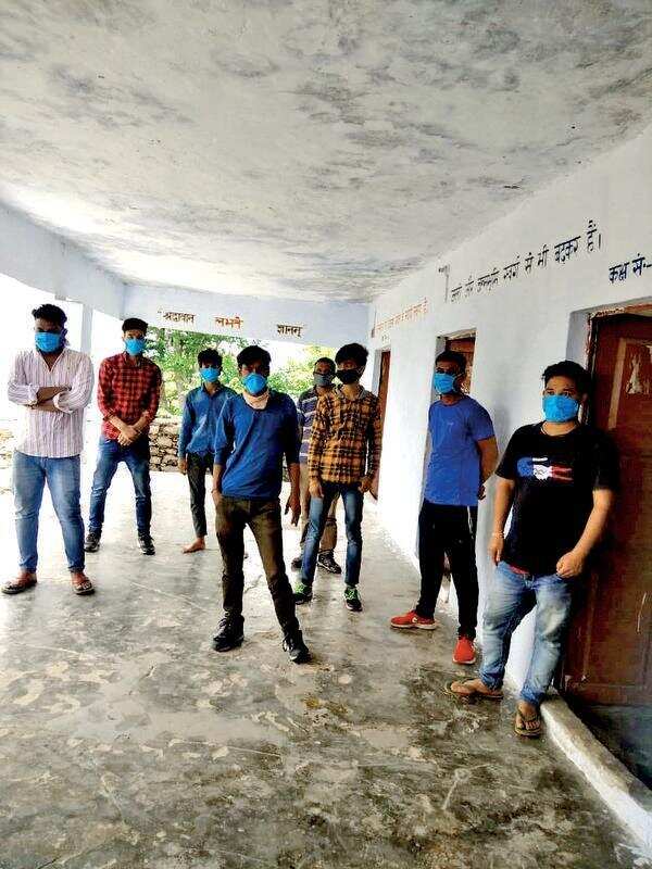 Migrant workers quarantined at govt school volunteer to revamp it
