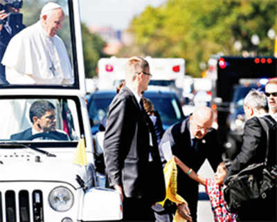 Girl, 5, jumps security to deliver immigration message to Pope Francis