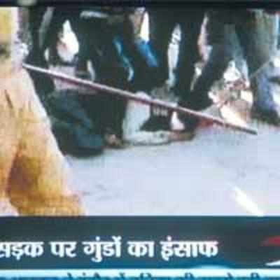 Mob brutally thrashes youth as police watch