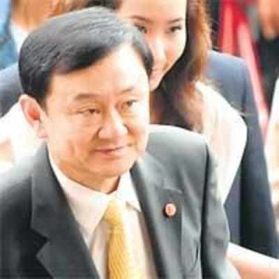 Former Thai PM Thaksin flees to UK