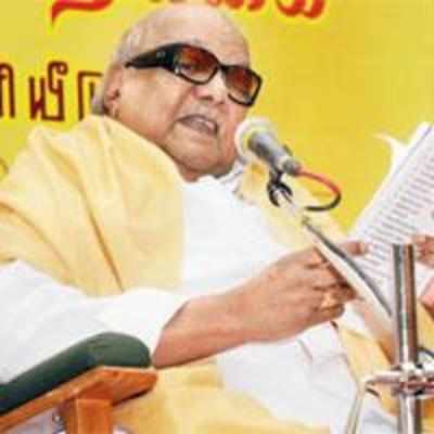 DMK woos voters with free laptops, 35 kg rice