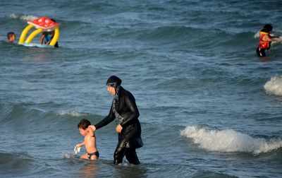 Fighting for 'soul of France,' more towns ban the burkini