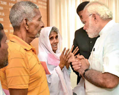 After navigating tricky political winds, Modi visits cyclone-affected regions