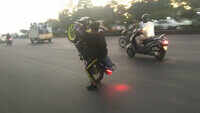 On cam: Underage bikers perform stunts on road 