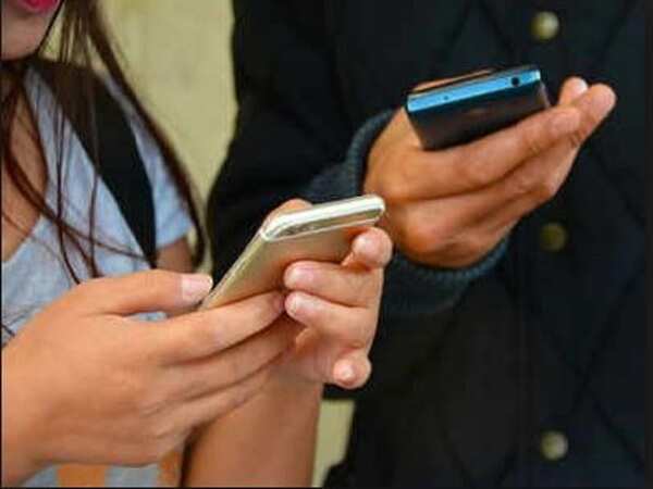 Eyes glued to cellphone, youngster falls in lift duct
