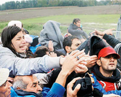 ‘Open the gate’: Thousands stranded at Balkan borders