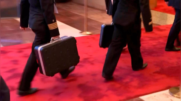 In pics: Russia's 'nuclear football' makes rare appearance during Putin ...