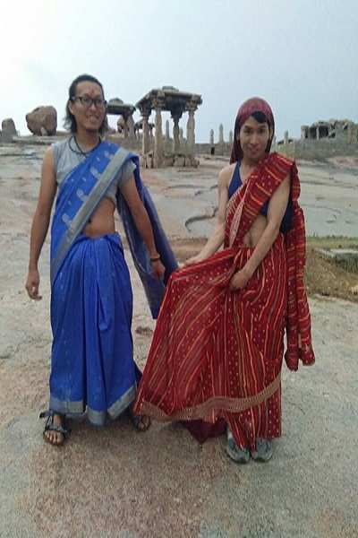 Hampi: These two male Japanese tourists can really carry off the sarees they are wearing