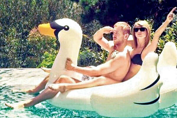Riding a swan in the pool is the new celeb trend