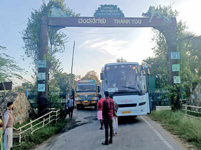 Bus stuck in the middle of forest lifted out with crane