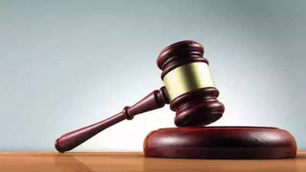 Plea against wall obstructing natural watercourse in village