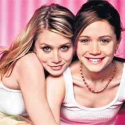 ...while the Olsen twins aim for identical noses