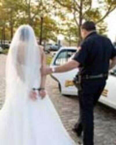 There goes the bride, wearing handcuffs