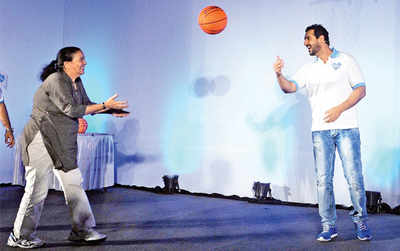 John Abraham plays basketball with his mother