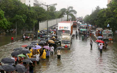 Rains halt Mumbai, commuters hit hard as trains cancelled
