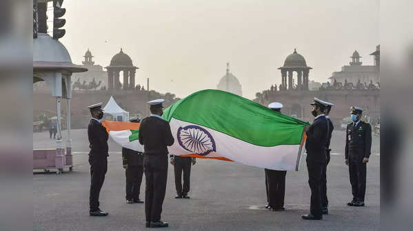 ​Navy personnel hold the Tricolour